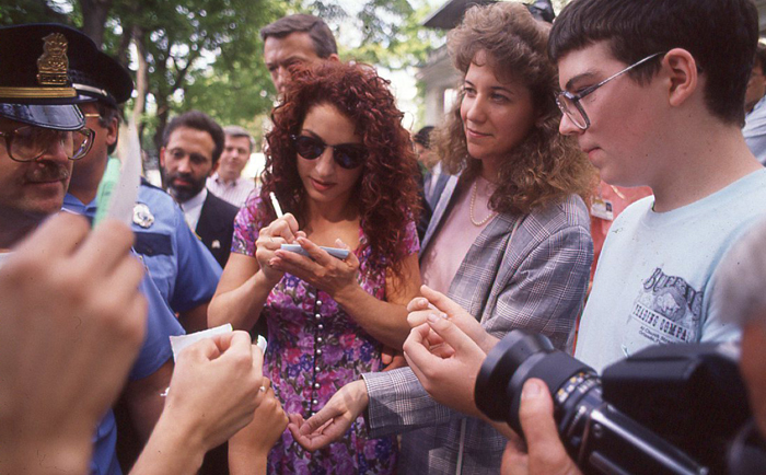 Woman signing autographs 