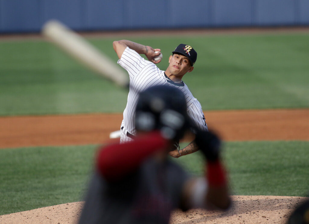 Jonathan Loaisiga throws a pitch in a game with the RailRiders