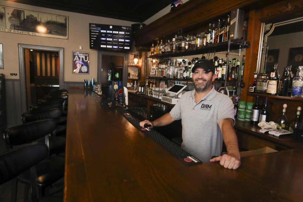 JAKE DANNA STEVENS / STAFF PHOTOGRAPHER West Scranton native Jason May operates the Angry Irishman pub on Bryn Mawr Street, where he honors the neighborhood’s blue-collar history and family-oriented values with good food at fair prices.