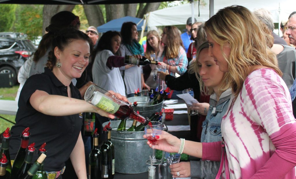 TIMES-SHAMROCK FILE PHOTO Alison Wilson of Tunkhannock serves up Nimble Hill wines for patrons at last year’s Tunkhannock Rotary Harvest and Wine Festival at Lazy Brook Park.