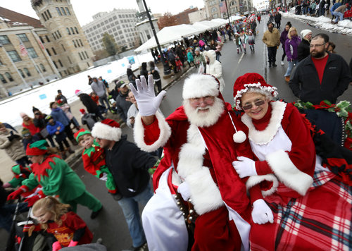 Santa and Mrs. Claus wave during the 2018 Santa Parade in Scranton.