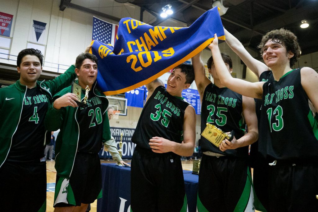 Players holding championship banner