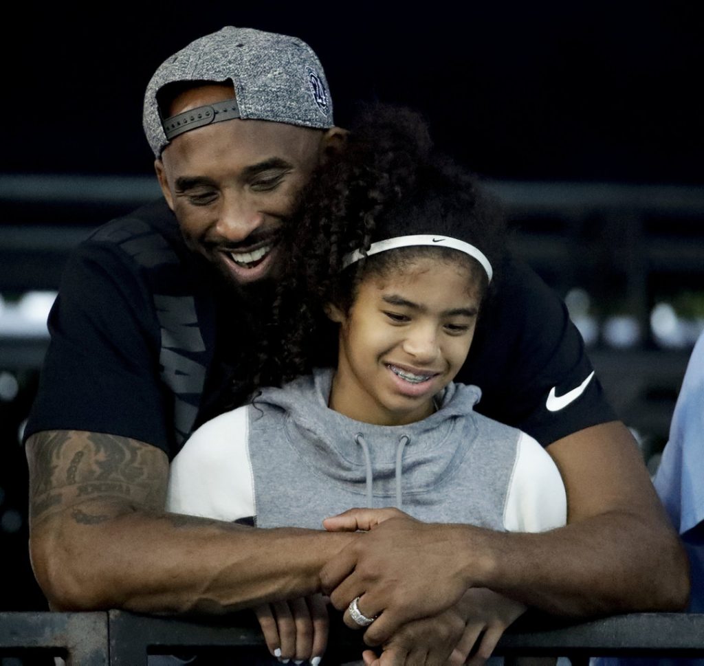 Kobe Bryant hugs his daughter, Gianna