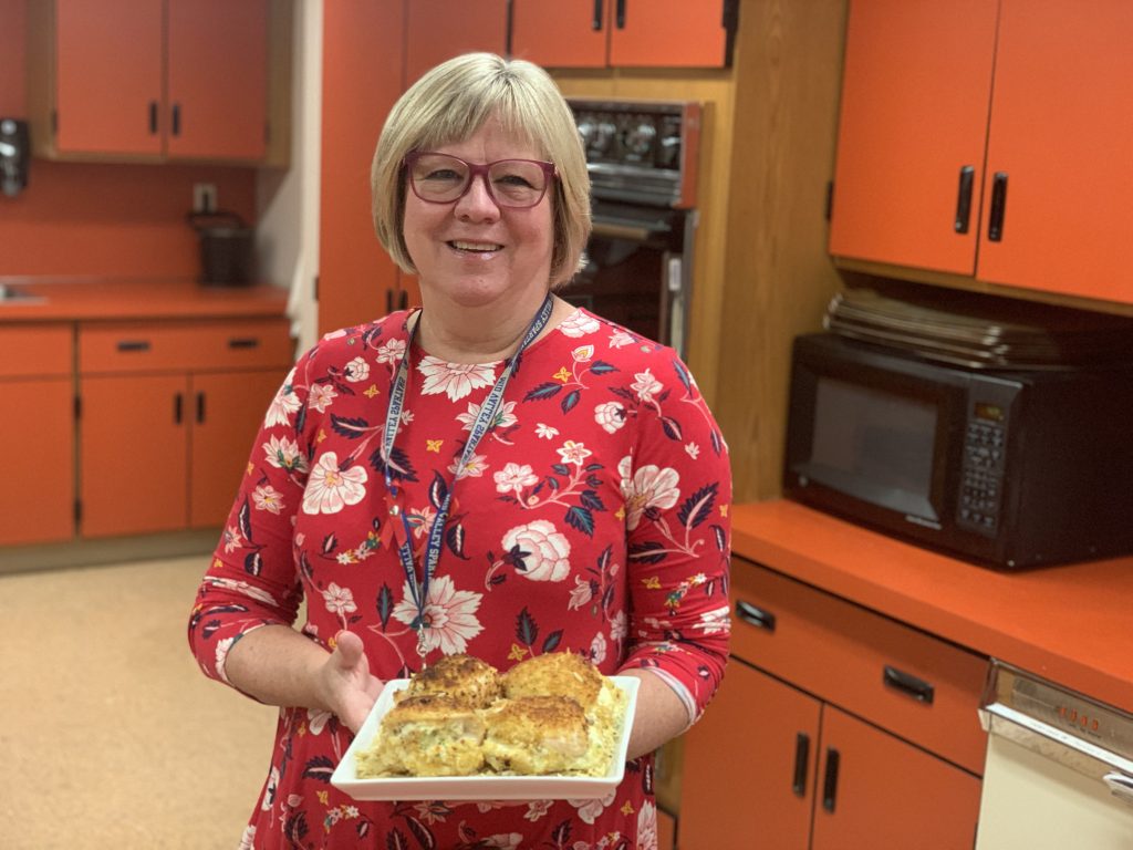GIA MAZUR / STAFF PHOTO Mid Valley Secondary Center family and consumer sciences teacher Lorna Engler displays Chicken Bombs, which earned the high school’s Advanced Foods class a grocery gift card through Local Flavor Gives Back.