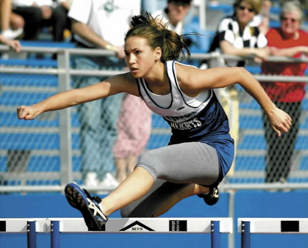 Girl running hurdles