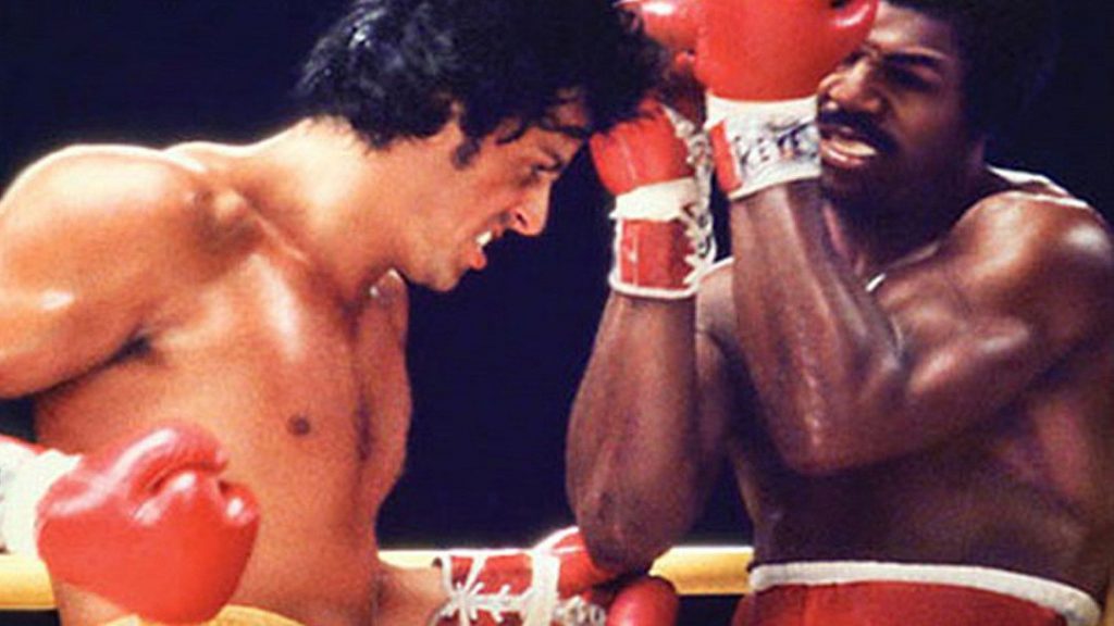 Rocky Balboa punching Apollo Creed
